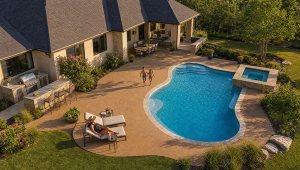 Aerial view of a DFW backyard pool and spa surrounded by tan TPV rubber deck surfacing
