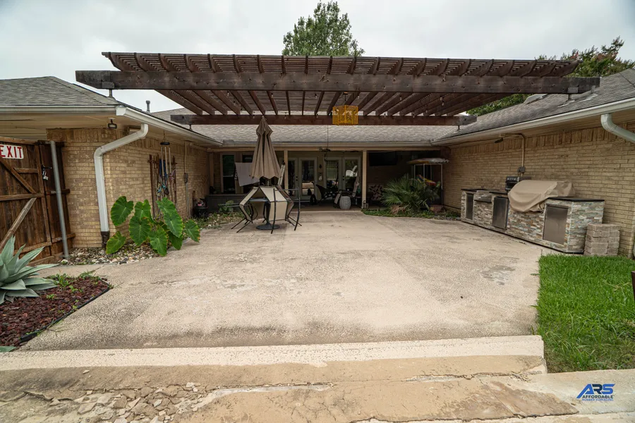 Covered Garland patio before surfacing work, showing the existing concrete floor
