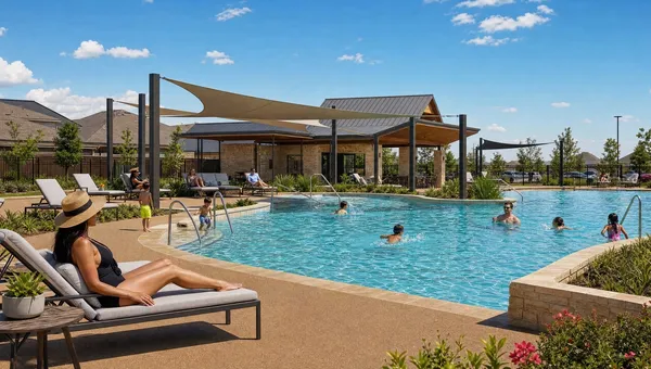 Community amenity pool with shade sails and residents on a TPV rubber pool deck